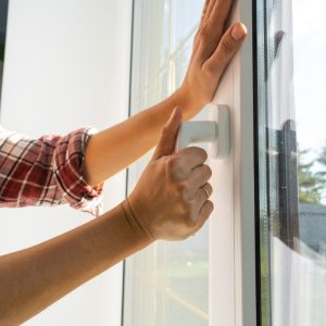 hand holding a window handle