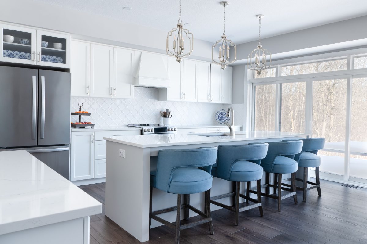 modern kitchen with blue bar stools 