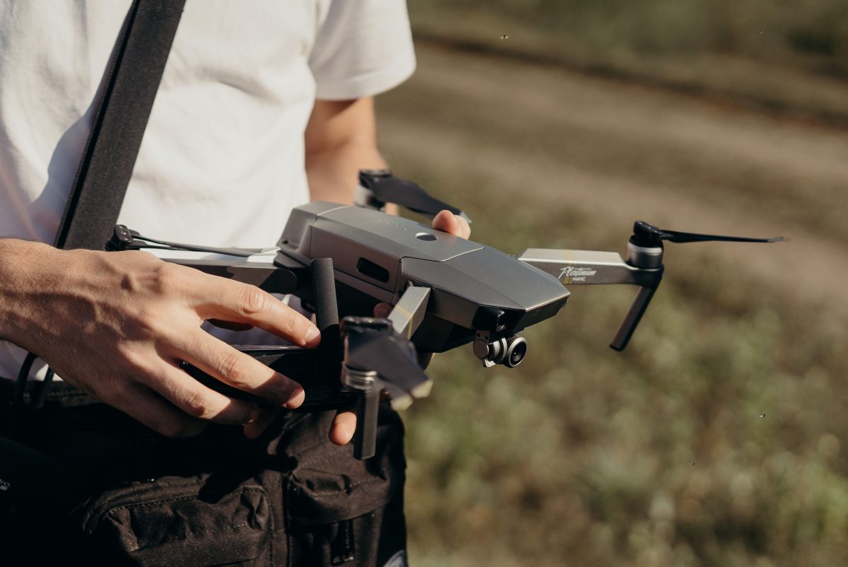 person holding dji mavic drone