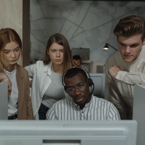 call center professionals looking at a computer