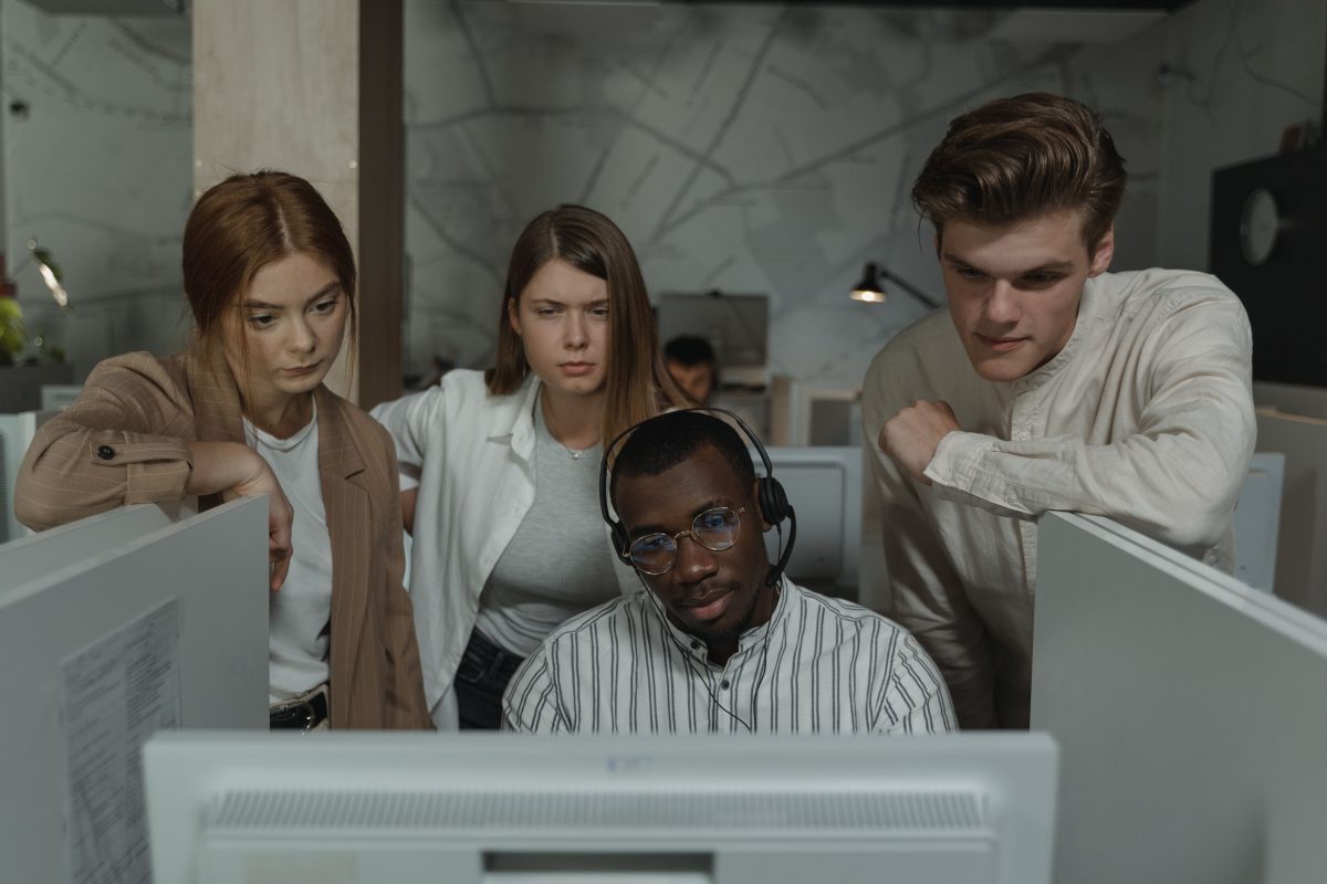 call center professionals looking at a computer