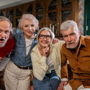 group of elderly folks pose for a picture