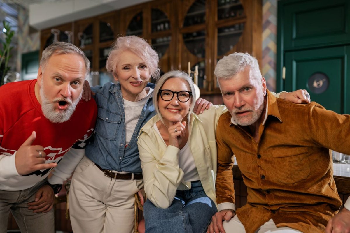 group of elderly folks pose for a picture