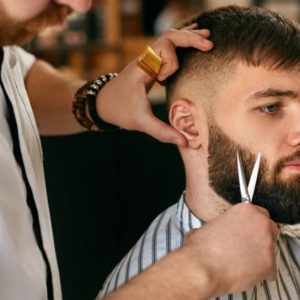 barber cutting beard