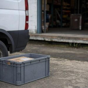 box sitting outside a delivery truck