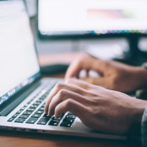 person using macbook computer