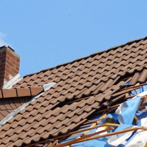 damaged roof being repaired