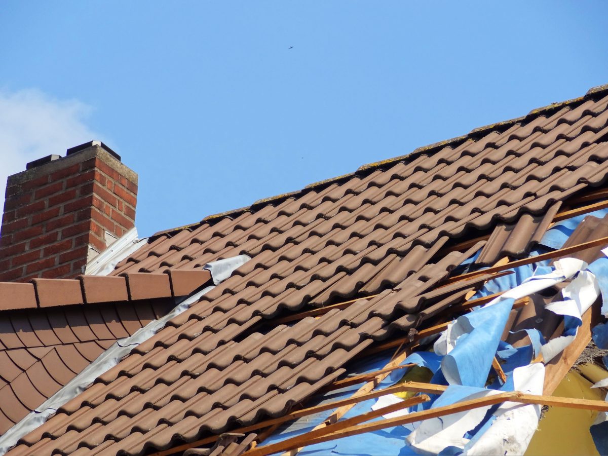 damaged roof being repaired