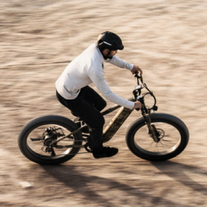 man riding ebike on dirt