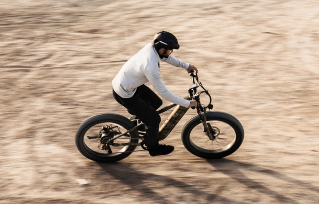 man riding ebike on dirt