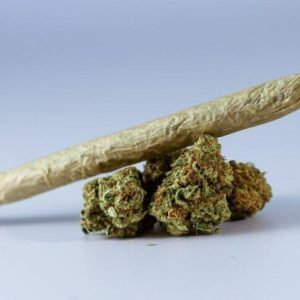 marijuana weed with rolled weed on top