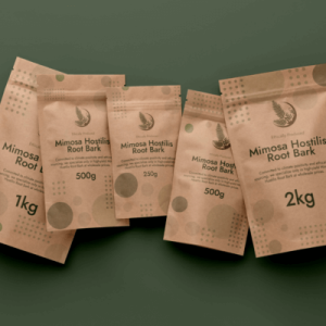 brown packages of mimosa hostilis root bark laying on green background