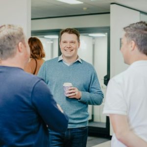 office staff standing talking
