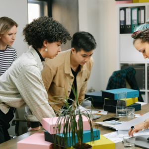 professional women in an office looking at paperwork on a desk