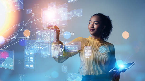 woman in yellow holding ipad looking at ai technology in space