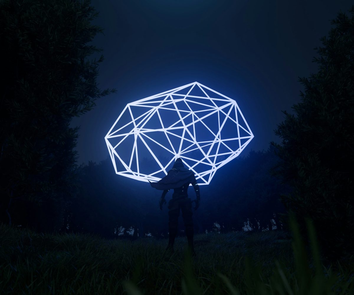 person standing with cape in darkness with large shape in the sky