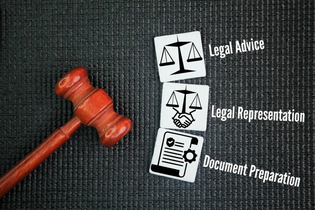 gavel on black table with legal images to the side