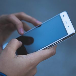 hands holding a smart phone