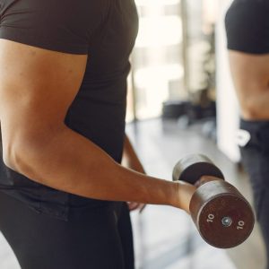 man lifting weights in a gym