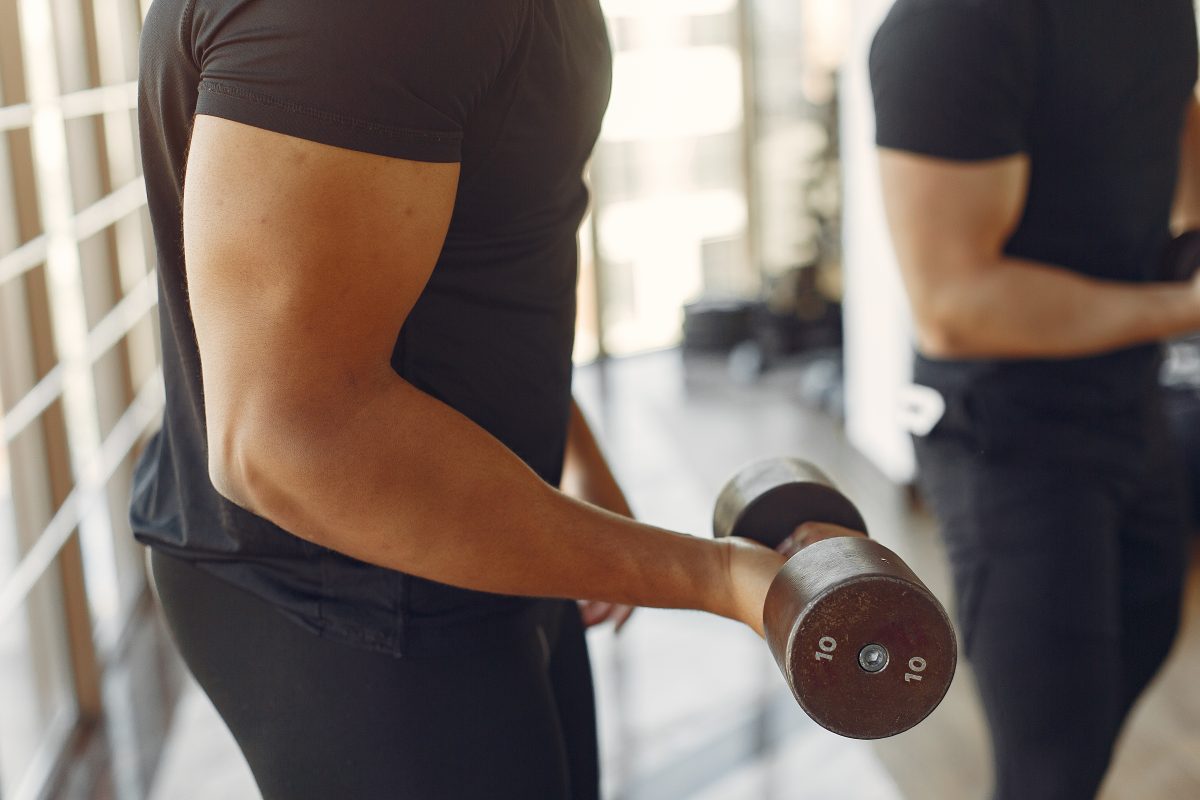 man lifting weights in a gym