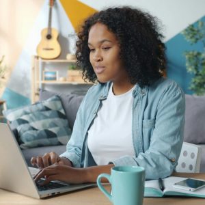 woman working on laptop in a living room