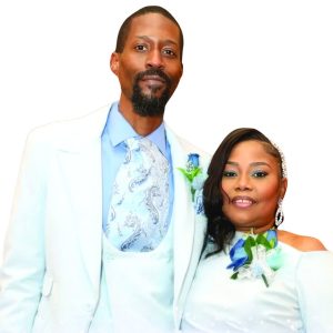 Pastor Jimmie Dale Burse Jr. and Lady Kimberlye Burse in light blue formal attire