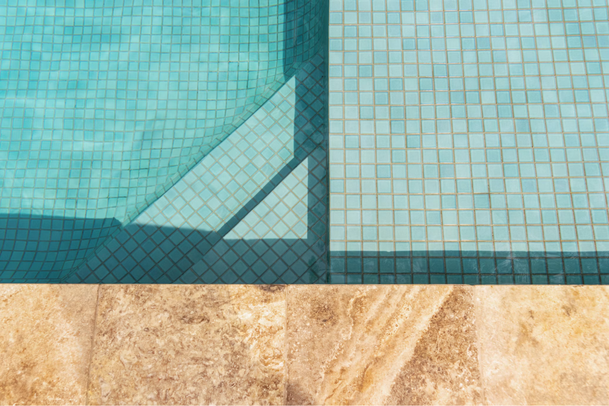 close up of side of pool with steps