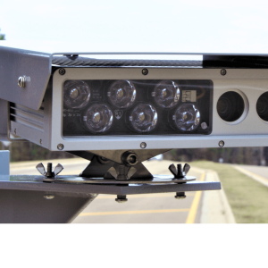 Close-up of an automatic license plate reader camera mounted beside a road