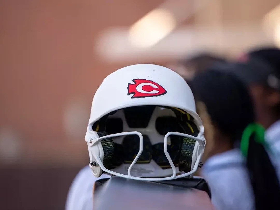 White Clinton Arrows softball batting helmet with a red C logo