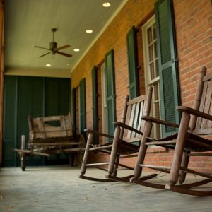Rocking chairs on a covered porch at the Clinton Visitor Center