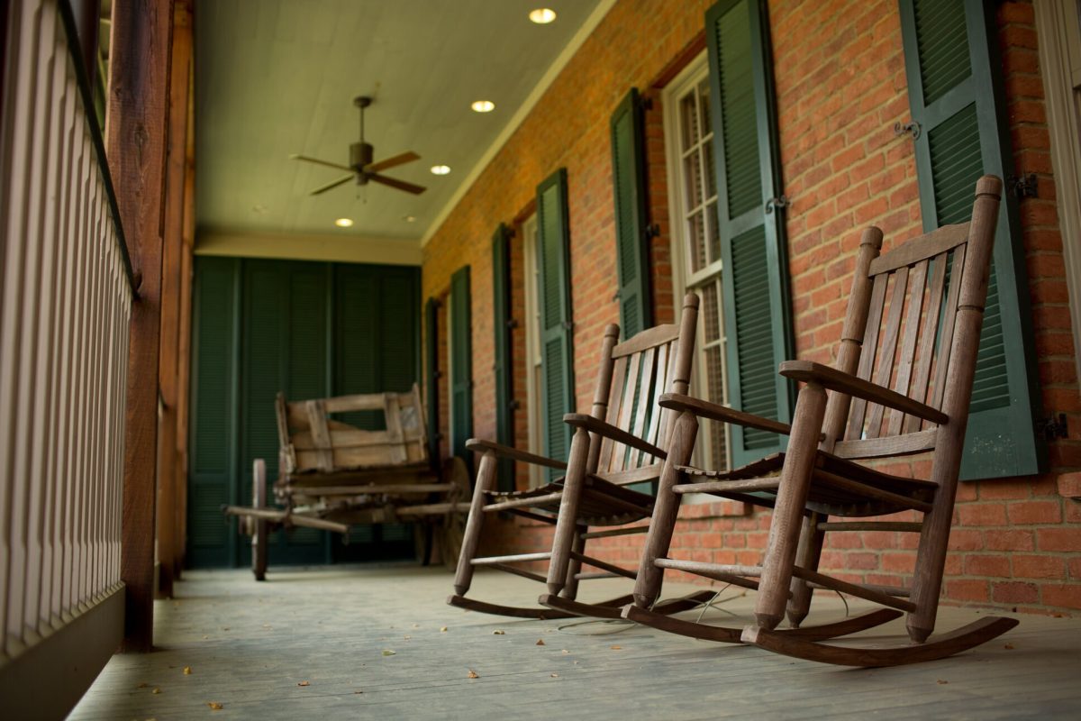 Rocking chairs on a covered porch at the Clinton Visitor Center