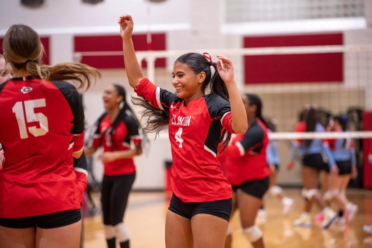 Clinton Lady Arrows volleyball players celebrating on the court