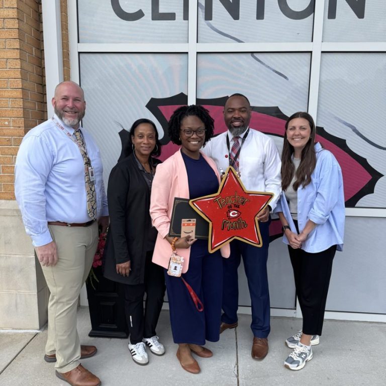 Clinton Junior High School recently honored Mrs. Kimple (center) as the school’s Teacher of the Month.