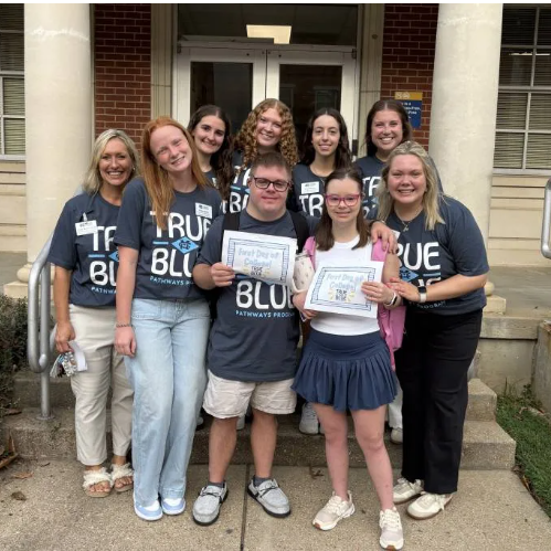 True Blue Pathways students Timothy Miller, front row center, and JoJo Talley, front row, second from right, are enjoying their first semester of college at Mississippi Christian University. They are surrounded by Cindy Melton, left, MC professor of interdisciplinary studies and director of True Blue Pathways, and MC students who serve as peer coaches, Mallie Maffett, front row, second from left, Morgan Pipkin, front row, right, and back row, from left, Ally Mattern, Gabby Ayers, Lexie Elenkov and Josey Clark.