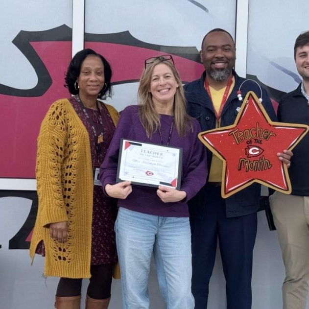 Clinton Junior High School recently honored Beth Torrence (second from left) as the school’s February Teacher of the Month.