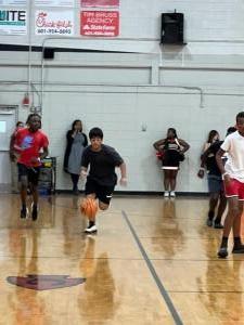Jr. high students play teachers in basketball game