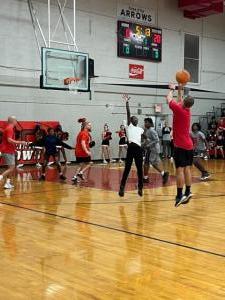 Jr. high students play teachers in basketball game