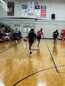 Jr. high students play teachers in basketball game